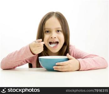 Young girl eating breakfast