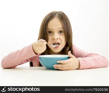 Young girl eating cereal
