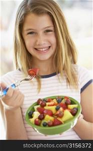 Young Girl Eating Fresh Fruit Salad