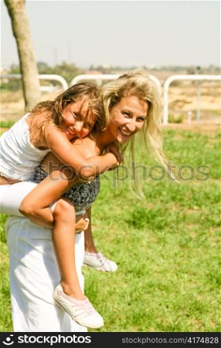 Young girl enjoying ride as they smile looking at camera