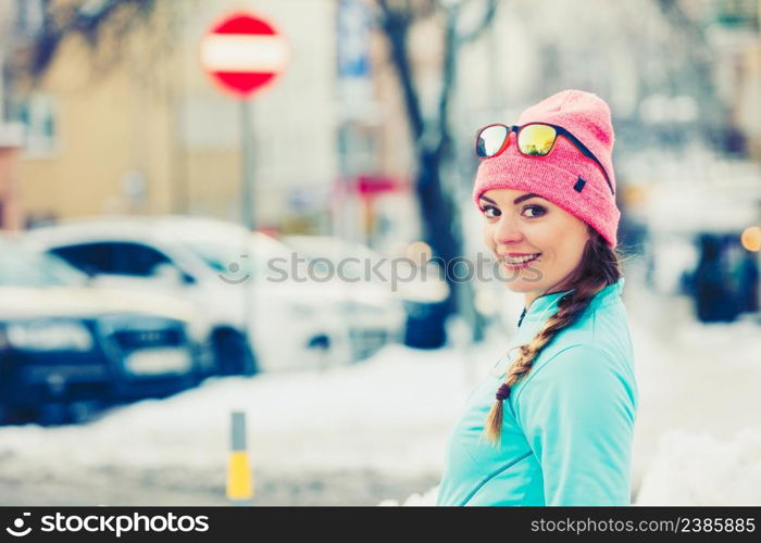 Young girl exercising on street. Fitness in winter aura. Health beauty workout concept. . Young girl exercising on street