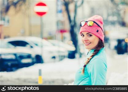 Young girl exercising on street. Fitness in winter aura. Health beauty workout concept. . Young girl exercising on street