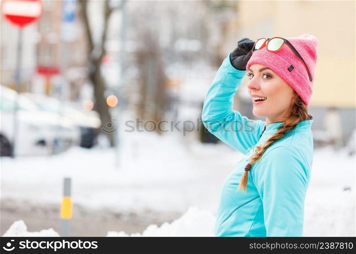 Young girl exercising on street. Fitness in winter aura. Health beauty workout concept. . Young girl exercising on street