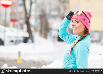 Young girl exercising on street. Fitness in winter aura. Health beauty workout concept. . Young girl exercising on street