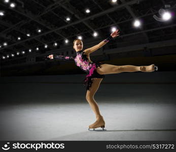 Young girl figure skater in sports hall