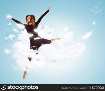 Young girl floating. Young girl flying among the feathers like a bird