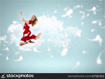Young girl floating. Young girl flying among the feathers like a bird