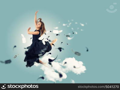 Young girl floating. Young girl flying among the feathers like a bird