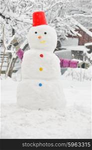 young girl have fun in wintertime making snowman