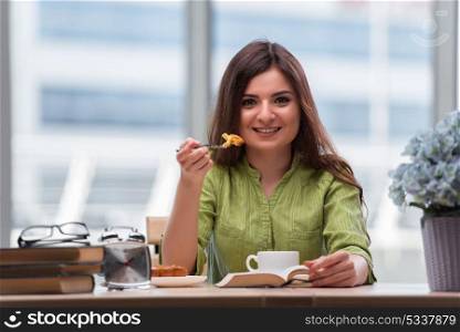 Young girl having breakfast at home