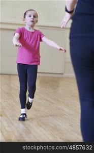 Young Girl Having Tap Dancing Lesson With Teacher