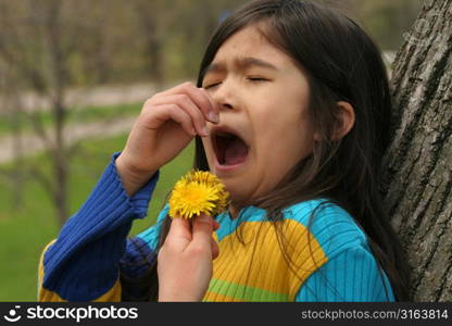 Young girl holding a flower