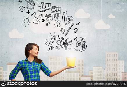 Young girl holding bucket with flying out sketches