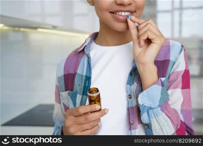 Young girl holding jar with pills, taking medication, vitamins, dietary supplement for female skin beauty, hair health, close-up. Smiling woman patient takes medicine, treated at home.. Young girl taking vitamins pills, dietary supplement for female skin beauty, hair health, close-up