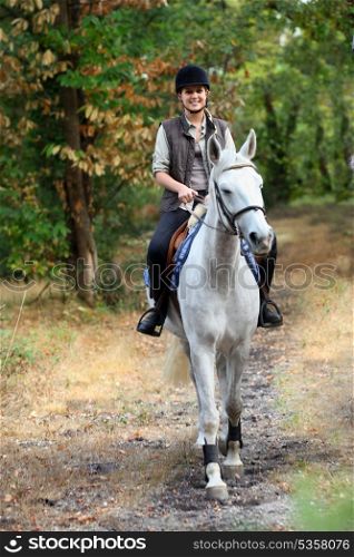 Young girl horseriding