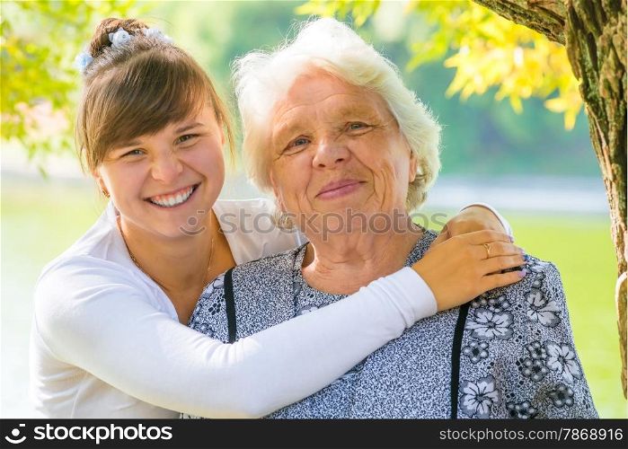 young girl hugging her beloved grandmother