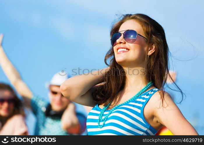 Young girl. Image of young attractive woman with friends at background