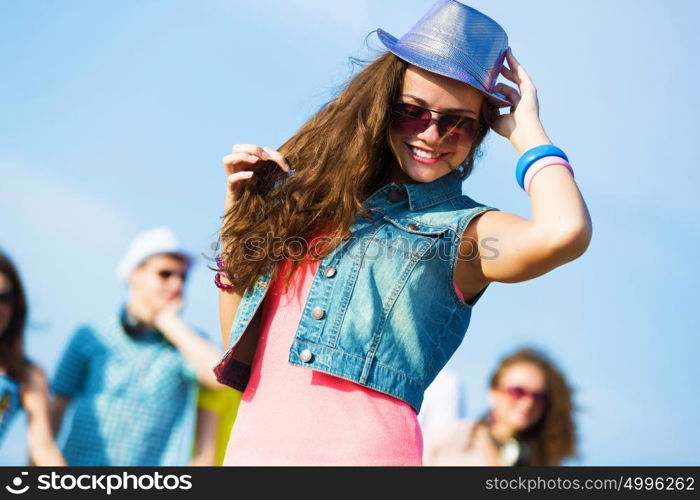 Young girl. Image of young attractive woman with friends at background