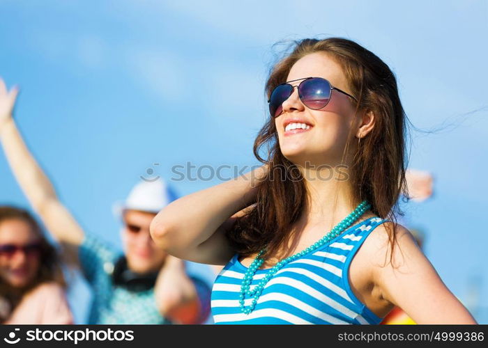 Young girl. Image of young attractive woman with friends at background