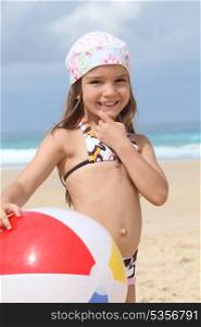 Young girl in a bandana with a beach ball