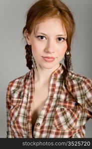 young girl in a checkered shirt