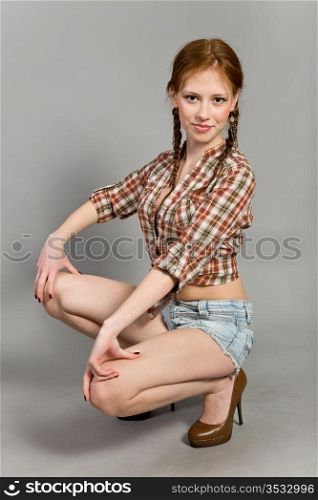 young girl in a checkered shirt