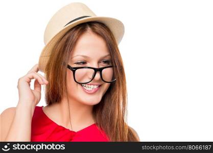 young girl in a hat and glasses on a white background isolated