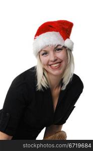 Young girl in a Santa Claus hat on the white background