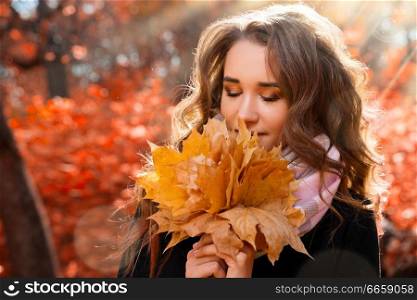 Young girl in autumn forest