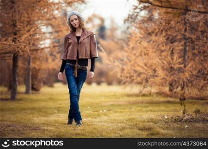 young girl in autumn park. girl in autumn park