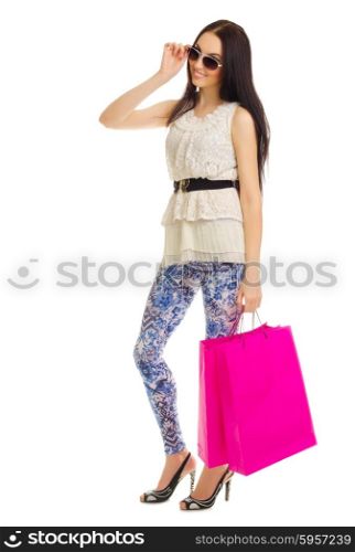 Young girl in blue pants with bags isolated
