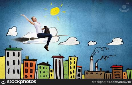 Young girl in casual flying on broom high in sky. Girl on broom
