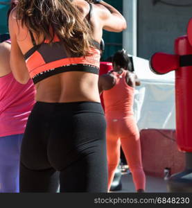 Young Girl in Fitness Sportswear and Punching Bags, Female Kickboxing Exercise in Outdoor Gym