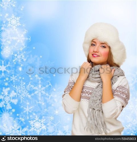Young girl in fur hat on winter background