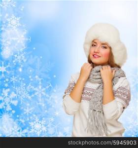 Young girl in fur hat on winter background
