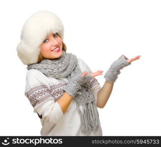 Young girl in fur hat shows welcome gesture isolated
