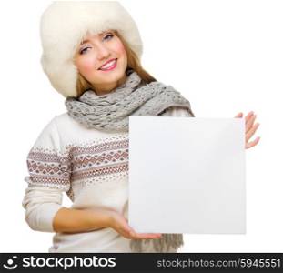 Young girl in fur hat with empty card isolated