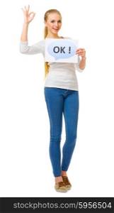 "Young girl in jeans with "Ok" poster isolated"