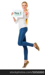 "Young girl in jeans with "Yes" poster isolated"