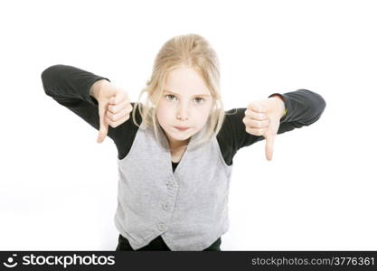 young girl in studio with both thumbs down against white background