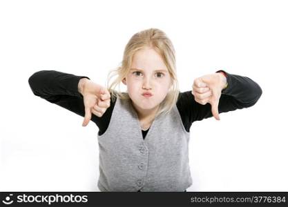 young girl in studio with both thumbs down against white background