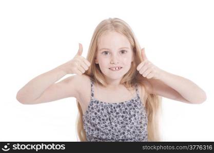 young girl in studio with both thumbs up against white background