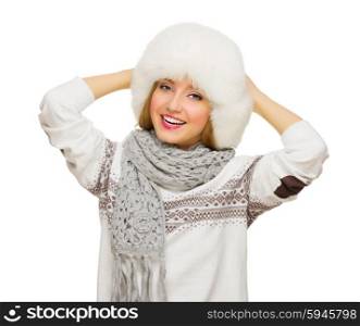 Young girl in sweater and fur cap