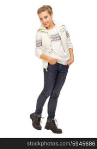Young girl in sweater and jeans isolated