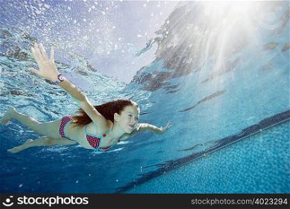 Young girl in swimming pool