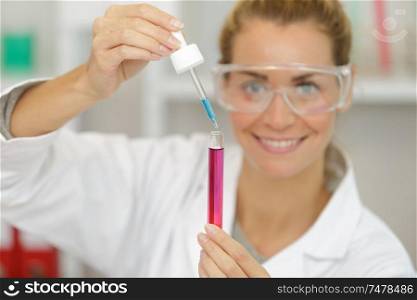 young girl in the laboratory doing experiments