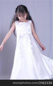 Young girl in white formal dress