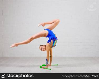 Young girl is engaged in art gymnastics