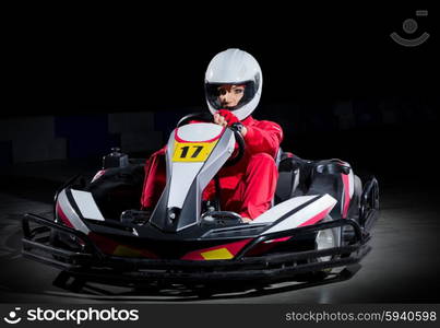 Young girl karting driver isolated