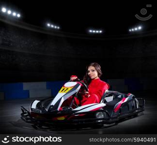 Young girl karting racer at stadium